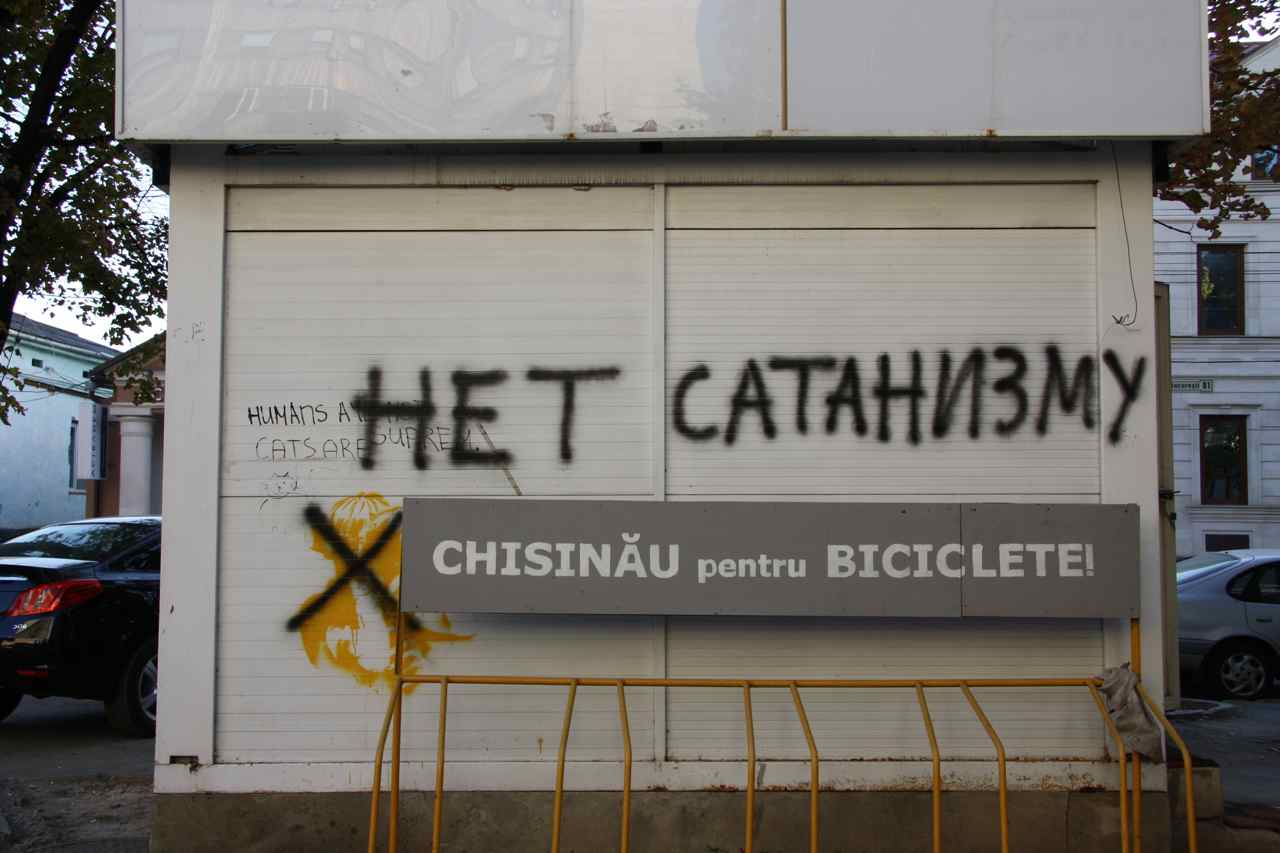 Outside a university: 'No to Satanism' / 'Chisinau for bicycles'