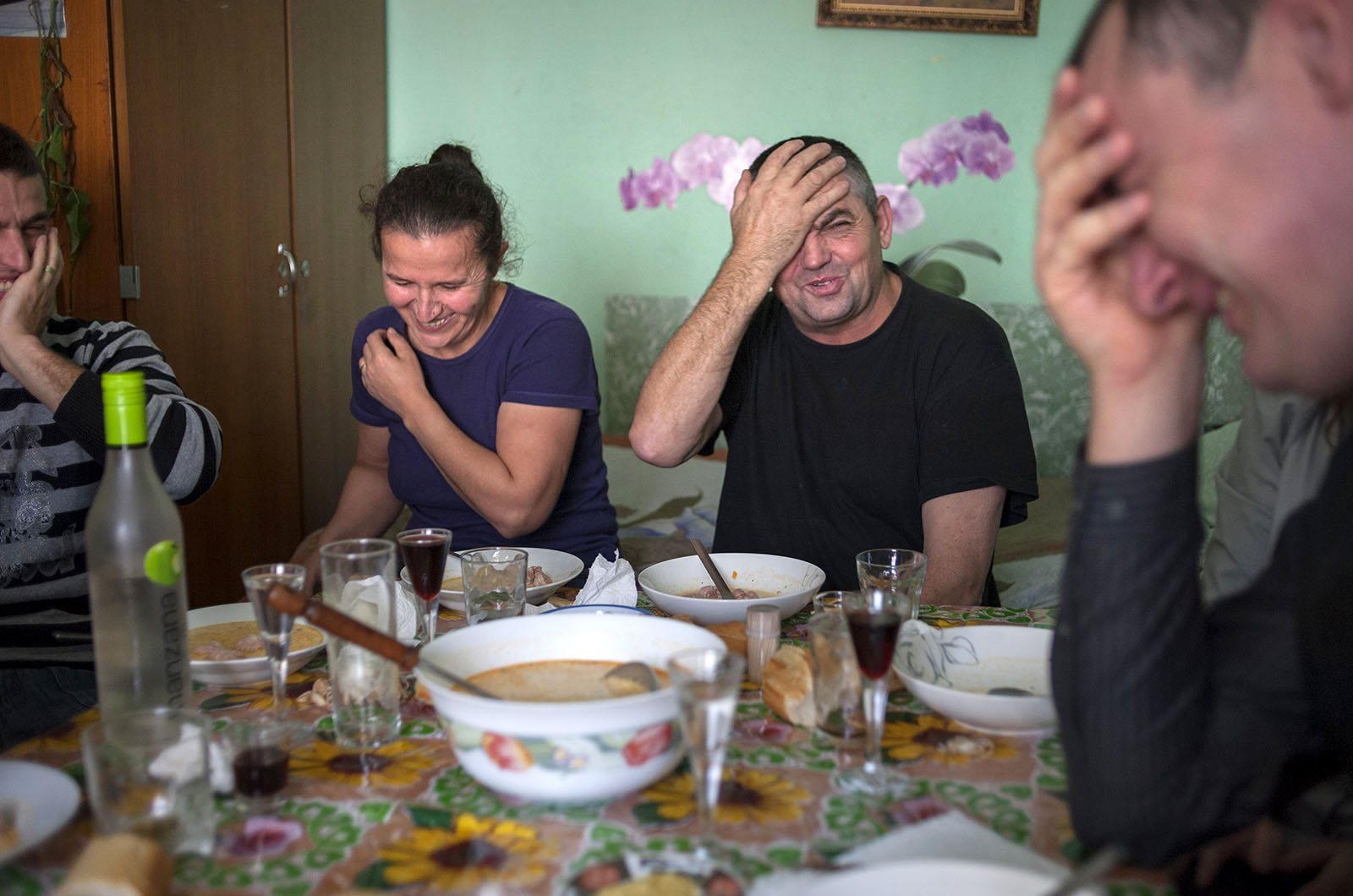 â€œThis is how we enjoy ourselves - birthdays, weddings and christenings. It is the same back home. We have never had a vacation,â€ Cotros, construction worker (photo Â© Petrut Calinescu) 