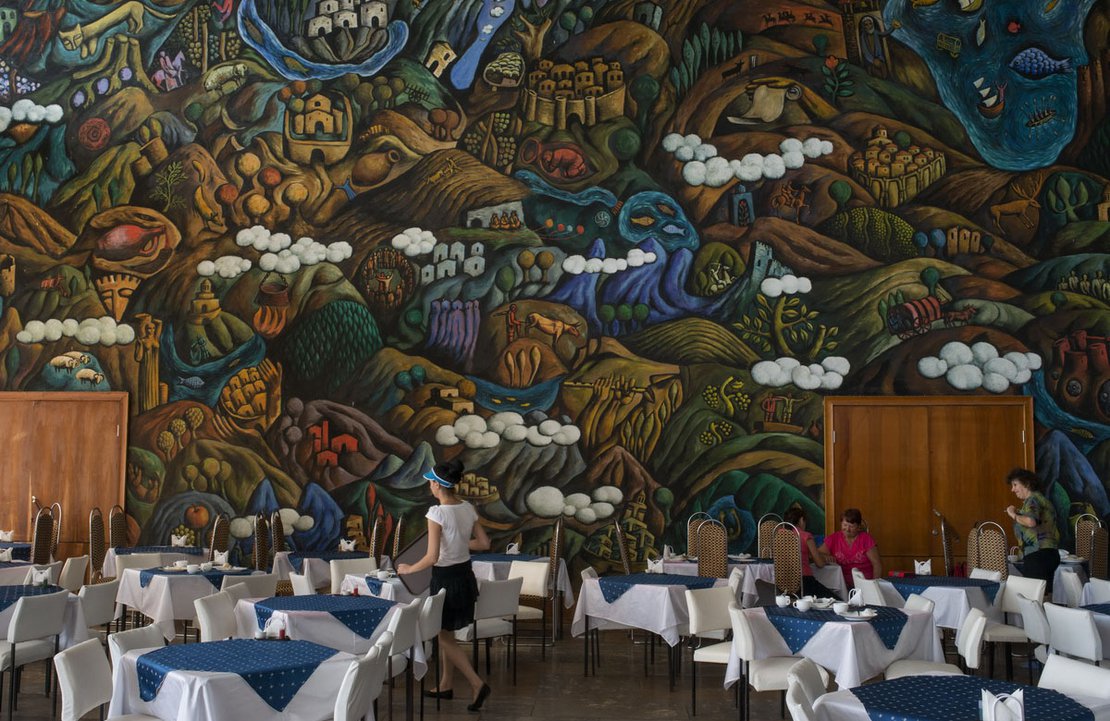 A recent mural painting in a canteen in Pitsunda, belonging to Intourist - the official state travel agency of the Soviet Union. It was founded in 1929 by Joseph Stalin and was staffed by NKVD and later KGB officials. Intourist was responsible for managing the great majority of foreigners` access to, and travel within, the Soviet Union